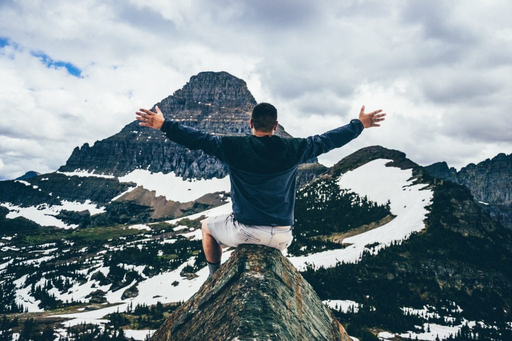 Scene of Mountain visible to man open arms to God's plan